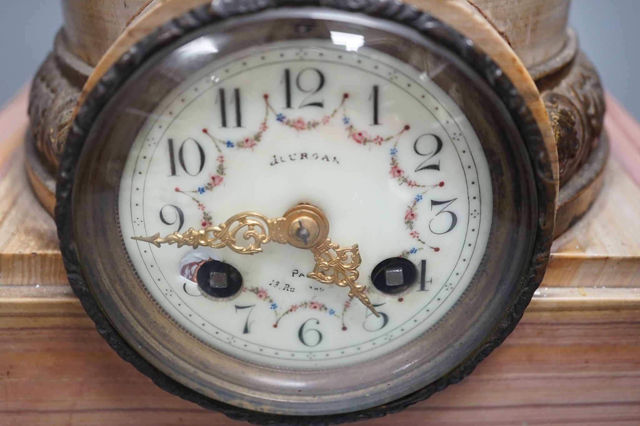 A spelter and marble figural mantel clock and a matching vase 47cm